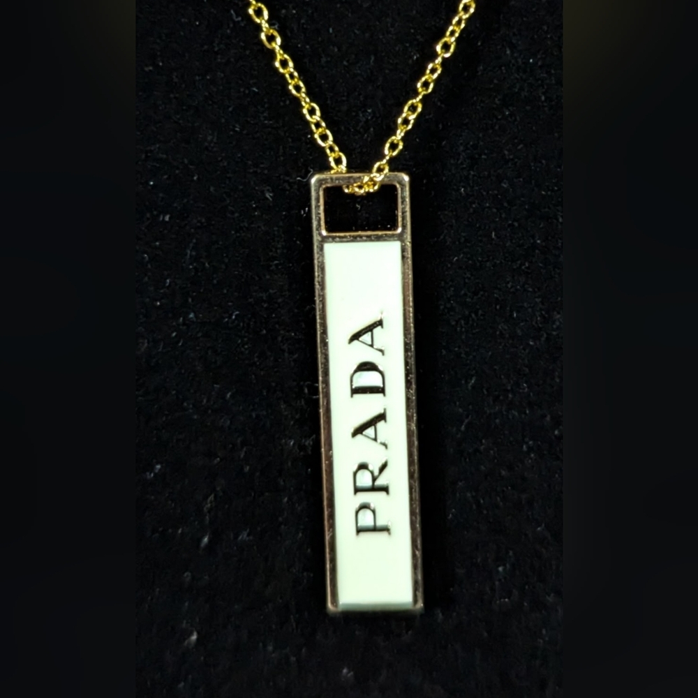Prada Gold and Cream Pendant Necklace